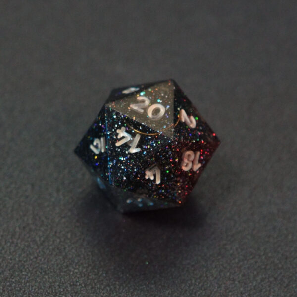 Unlit Midnight Galaxy D20. Midnight Galaxy colorway is a mostly translucent dark smoke black resin base packed with rainbow glitter of various sizes. The numbers or symbols are painted pearl white.