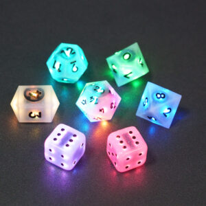 Set of 7 lit Aurora Sky dice with a rainbow of colors across all faces. Set Includes: 1 D20, 1 D12, 1 D10, 1 D8, 2 Pipped D6, 1 D4. Aurora Sky colorway is a mostly translucent white resin base packed with small blue and silver glitter throughout. The numbers or symbols are painted metallic black.