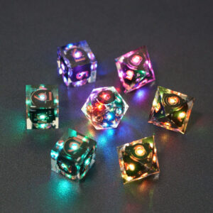 Set of 7 lit Clear dice with a rainbow of colors across all faces. Set Includes: 1 D20, 3 D8, 3 D6. Clear colorway is fully transparent resin allowing internal circuit board to be visible. The numbers or symbols are painted metallic copper.