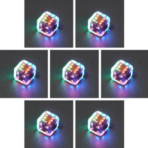 Collage of 7 lit Clear Pipped D6 with a rainbow of colors across each face. Clear colorway is fully transparent resin allowing internal circuit board to be visible. The numbers or symbols are painted metallic copper.